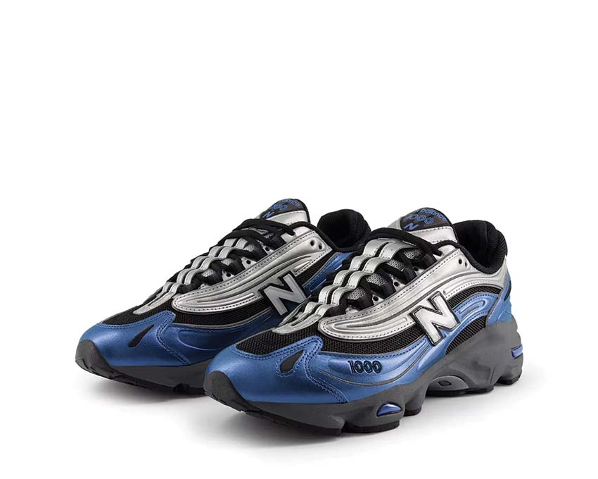 New Balance 1000 Metallic Blue vue latérale — reflets métalliques sur tige
