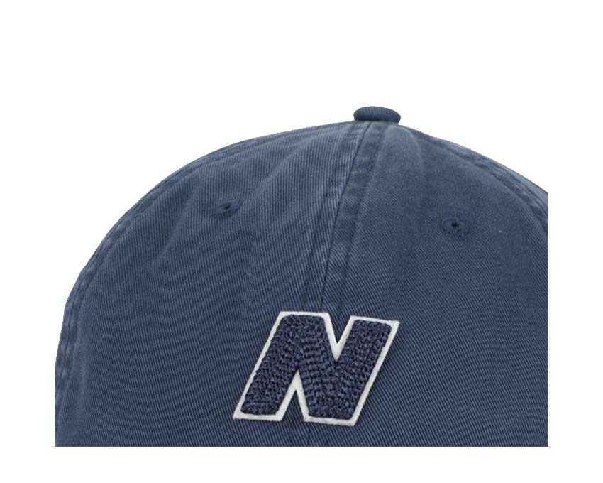 New Balance Cap Navy vista laterale — visiera curva regolabile