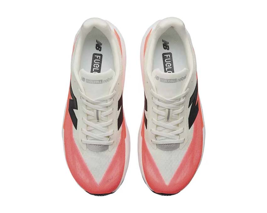 New Balance FuelCell Rebel v5 Urgent Red detail — NB logo white-red contrast