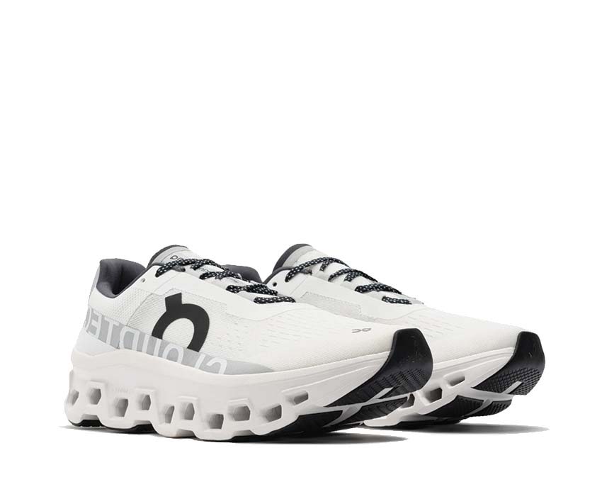 On Cloudmonster W All White vue latérale — profil amorti maximaliste femme