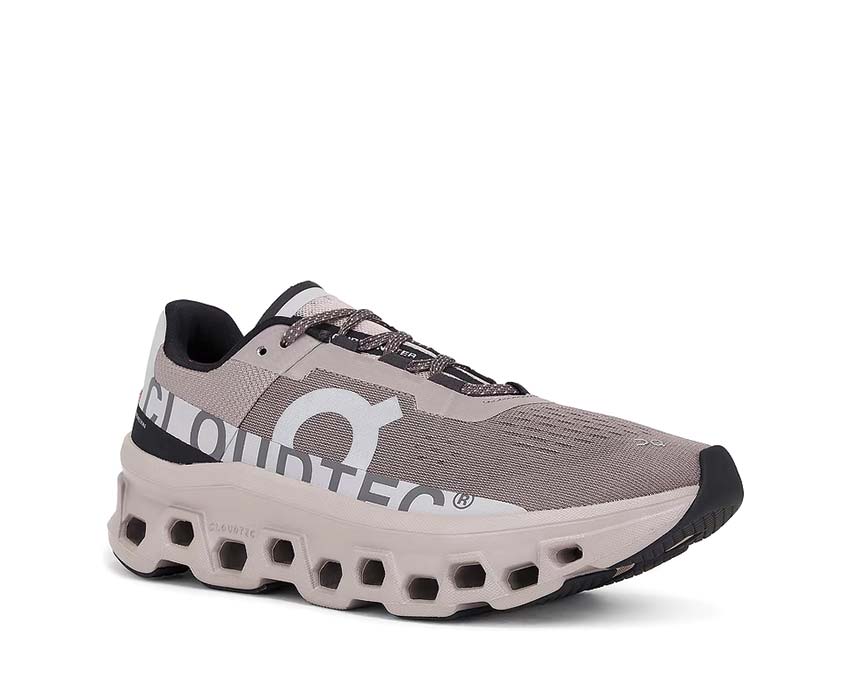 On Cloudmonster Cinder/Fog vista lateral — perfil amortiguación máxima hombre