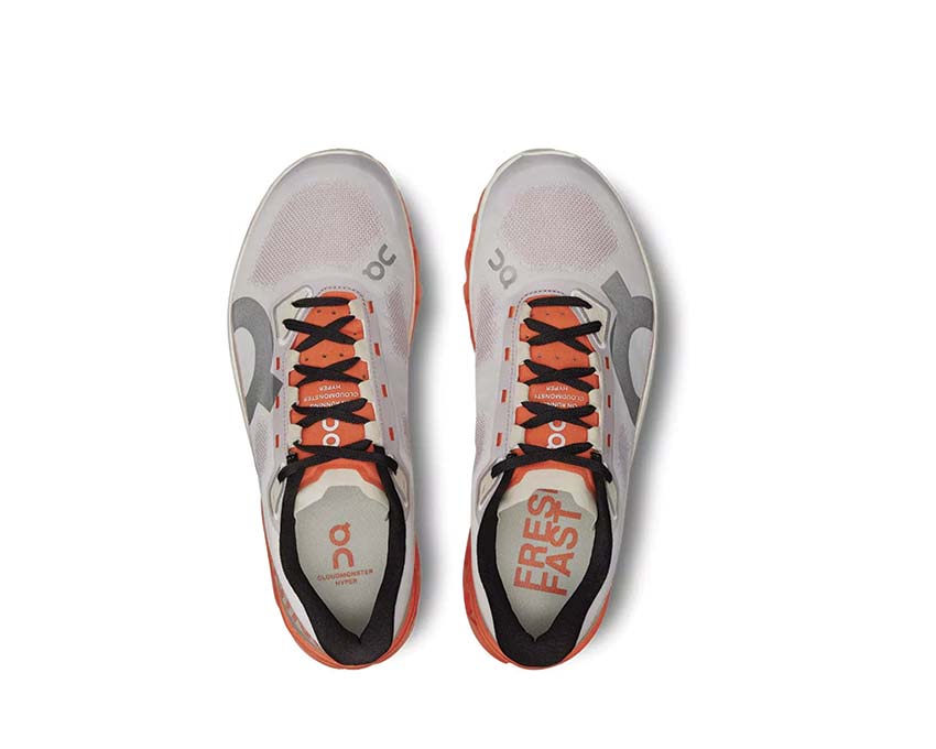 On Cloudmonster Hyper Mauve/Flame vista lateral — perfil racing hombre