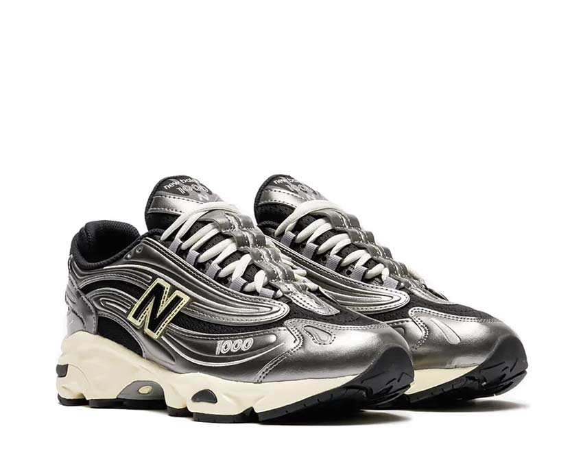 New Balance 1000 vista lateral — parte superior de ante y nubuck