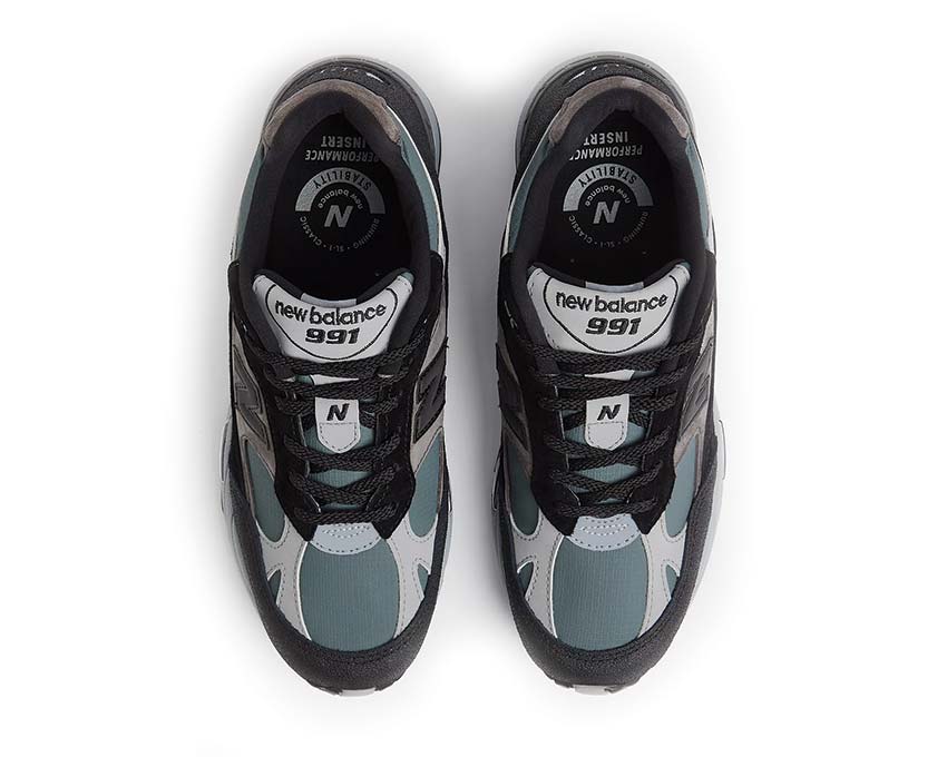 détail — New Balance 991 V1 empiècements suède noir turbulence urban