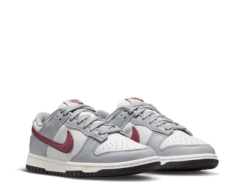 Nike Dunk Low Black White vista lateral — cuero liso bicolor